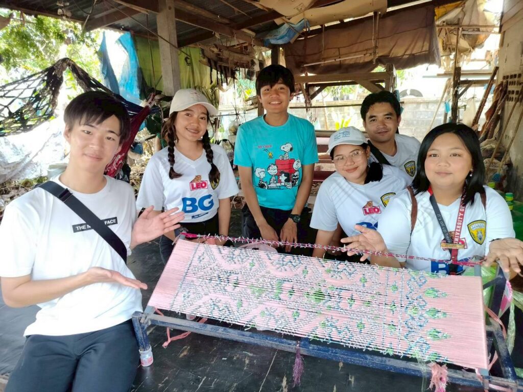 The UB exchange students exploring the Thai silk weaving industry.